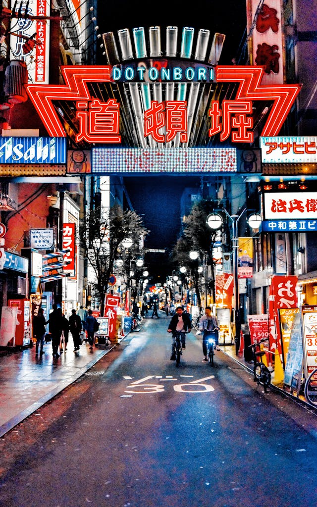 Explore the neon-lit streets of Dotonbori in Osaka, Japan, a bustling hub of nightlife and culture.